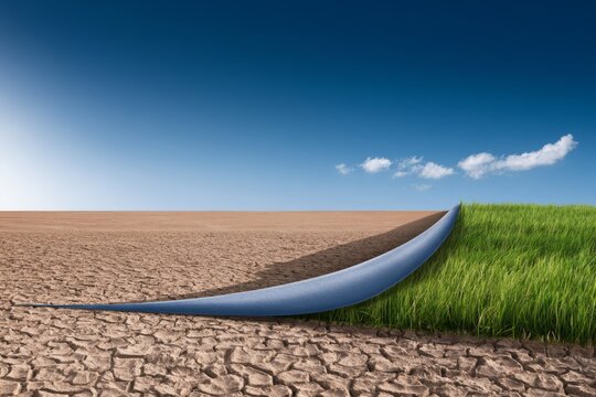 Transformation of Dry Desert Landscape into Lush Green Surface with Blue Sky and White Clouds