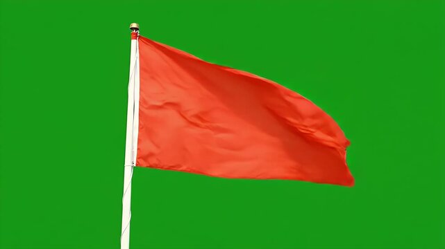 Red Corner Flag Waving Vigorously in Wind on Green Screen - A solitary red corner flag whips and billows dynamically in strong winds against a vibrant, solid green screen background.
