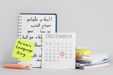Fototapeta premium Arabic language day celebration with december calendar, notebook, and highlighter, educational learning