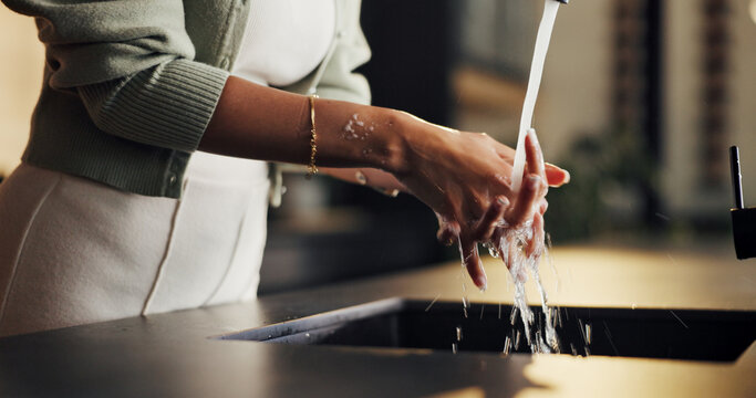 Hygiene, faucet and woman washing hands in kitchen for healthcare, wellness or disinfectant. Water splash, sink and person cleaning skin for prevention of bacteria, remove dirt or germs in home