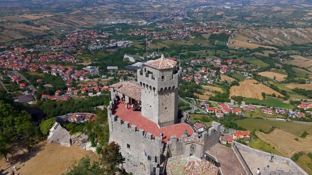 Aerial birds eye circling view of Guaita Tower, San Marino