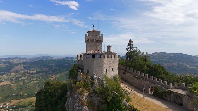 Aerial drone view circling Cesta Tower on Monte Titano, San Marino
