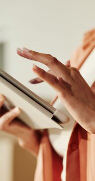 Hands, tablet and scroll in home for renovation, construction or interior design with refurbishment app. Planning, person and review online layout with digital floorplan and house remodeling project