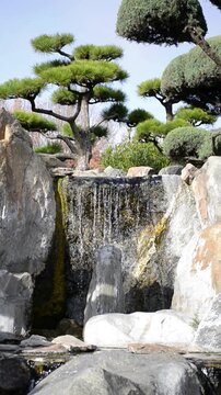 Close up of small waterfall flowing over rocks
