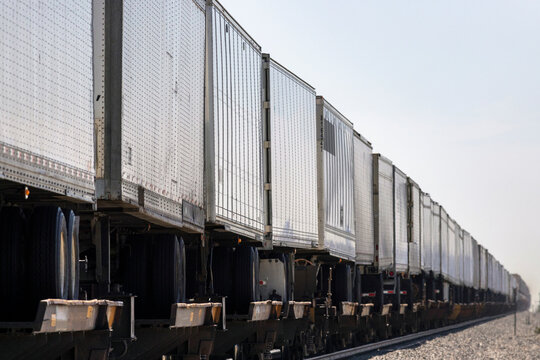 Long intermodal freight train with many semi trailers