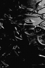 Fototapeta premium High contrast monochrome image of a heavily scratched, distressed metal or stone surface
