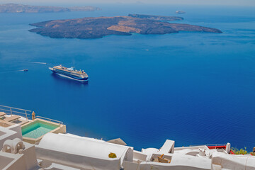 Fototapeta premium Santorini, Greece, the caldera panorama with a cruise ship sailing on deep blue Aegean waters