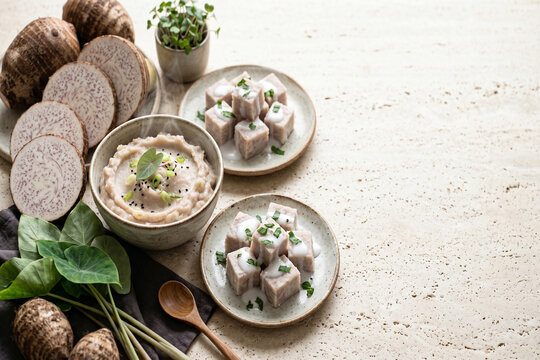 Taro root mash and steamed cubes with coconut cream and green onions