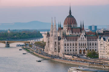 Fototapeta premium Stunning dusk view of the Hungarian Parliament Building across the Danube River in Budapest