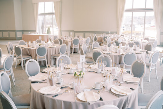 Elegant wedding reception banquet hall with round tables