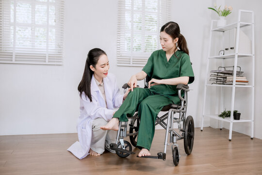 Doctor Examining Patient's Leg During Rehabilitation Session