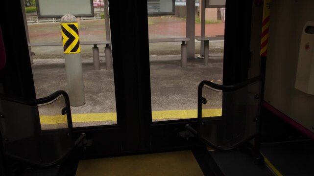 Bus doors closing at the urban station