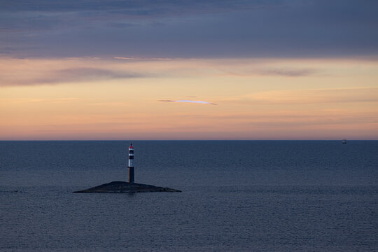 beacon on an islet at sunset, Atlantic Road, Norway