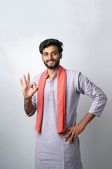 Fototapeta premium Happy indian farmer showing on white background