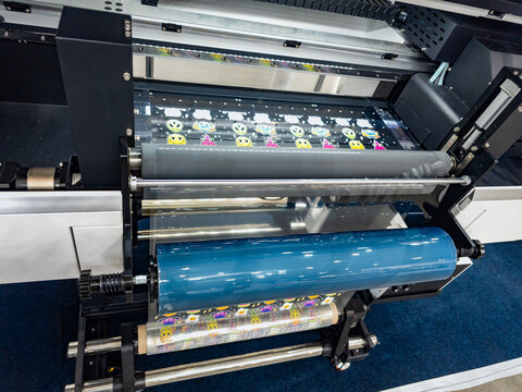 Modern UV DTF Printer and Laminator Machine Producing Colorful Custom Stickers
