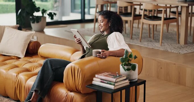 Happy woman, reading and relax with tablet in lounge, entertainment and chilling with coffee on couch. Reader, smile and internet connection for fiction ebook, online and person with tea in house