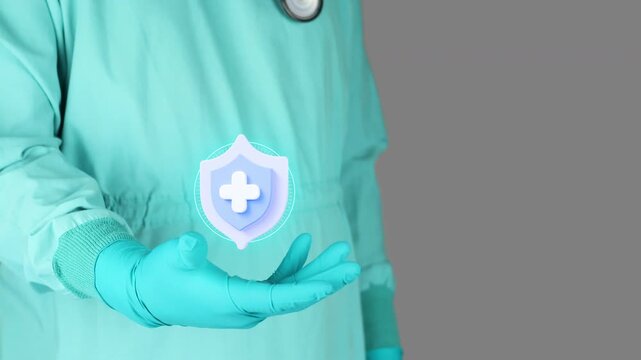 Doctor in green uniform presents the 3D shield. Concept of health insurance, comprehensive medical coverage, financial peace of mind, prevention and awareness of access to health and preventive care.
