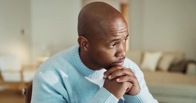 Mental health, thinking or black man in home with worry, regret and memory of past trauma. Guilt, space or male person in house with reflection, overthinking and flashback doubt in living room.