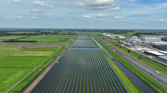 View of a large solar farm with rows of solar panels in Europe