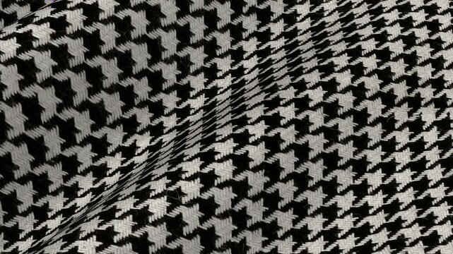 Black and White Houndstooth Tweed Fabric shifting in elegant retro waves of rich textured wool material for vintage style autumn tailoring