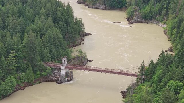Old metal bridge crossing over the fraser river in the fraser canyon of British Columbia