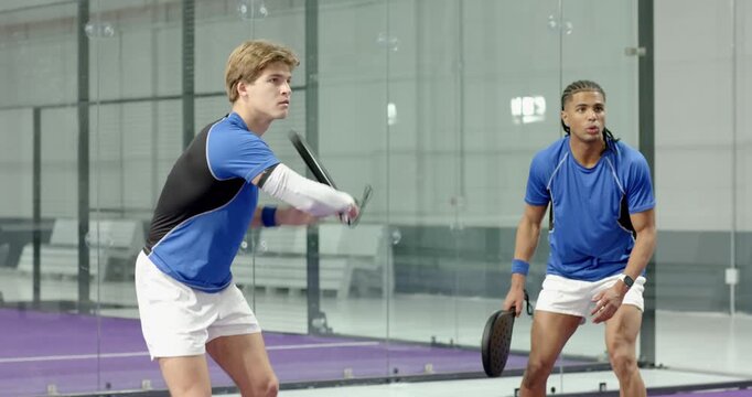 Incoming ball sending sports partners at net swinging volley then smashing overhead and returning