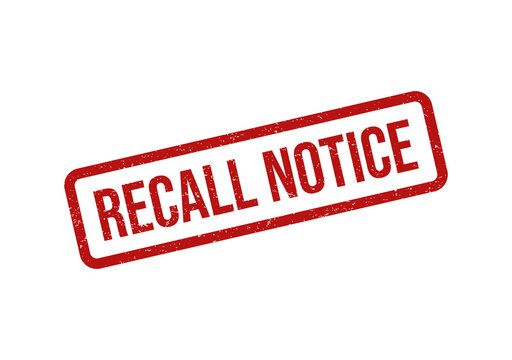 Red grunge rubber stamp with the text recall notice on a flat surface