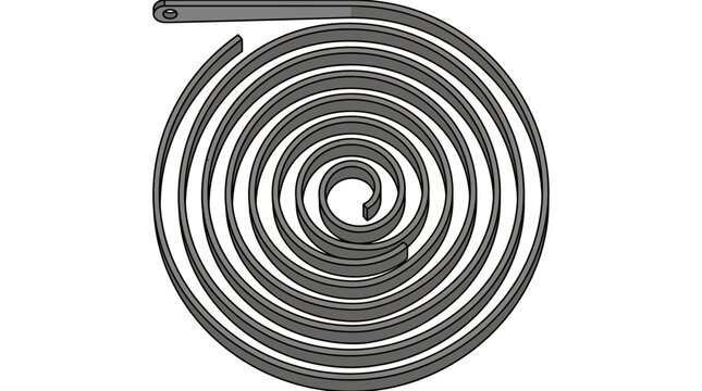 A coiled metal spring lies on a flat surface indoors.