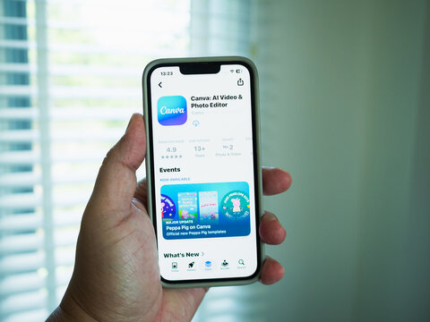 Chachoengsao, Thailand - June 13, 2026: Exploring canva application a smartphone a user's experience indoor setting digital content engaging perspective