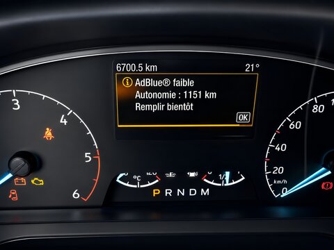 Low AdBlue Warning Message on Car Dashboard &ndash; Diesel Emissions System Alert