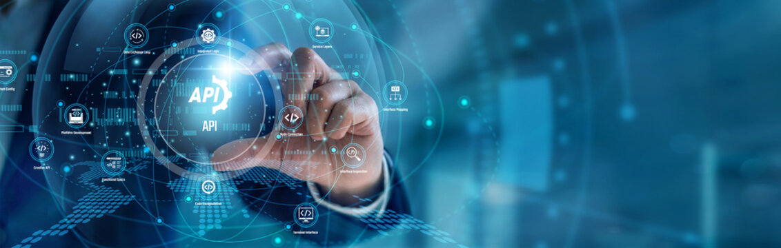A lead developer handhold API integration. Tech engineer using workstation connecting microservices and data pipelines on a dual screen. Software architecture and scalable cloud networks.