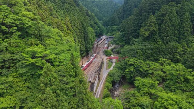 Aerial Dolly‑In Shot of Gokurakubashi Station Surrounded by the Mountains of World Heritage Koyasan, Koya Town, Wakayama, Japan　空撮ドリーイン 「極楽橋(ごくらくばし)駅に到着するGRAN天空」和歌山県高野町
