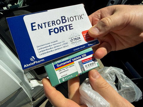 Antibiotic boxes held in hands in a car with daylight suitable for medical editorial, healthcare marketing, patient education, 5 May 2026 Subitica, Serbia