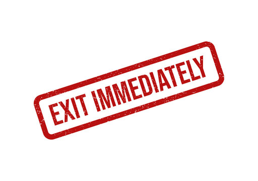 Red rubber stamp impression with the text exit immediately on paper