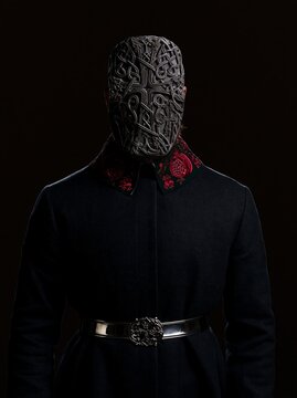 A man wearing an Armenian khachkar-inspired stone carved mask with interlacing vine patterns
