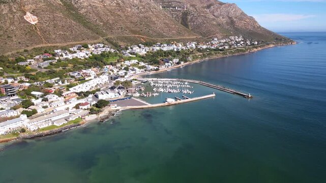 Scenic Gordon's Bay seaside resort and harbor with marina on False Bay. Aerial