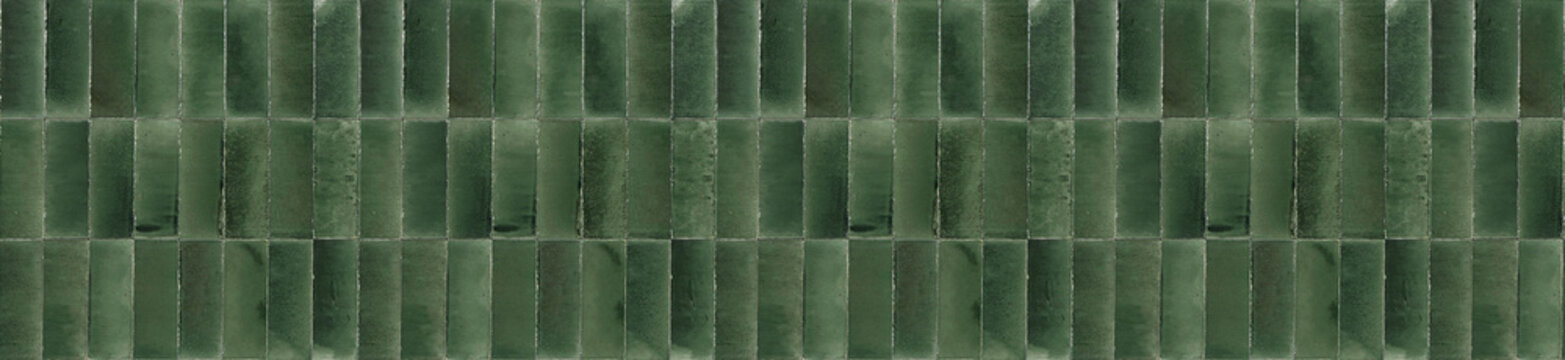 Panoramic banner of deep emerald green ceramic tiles arranged in a vertical pattern for luxury interior wall decoration.