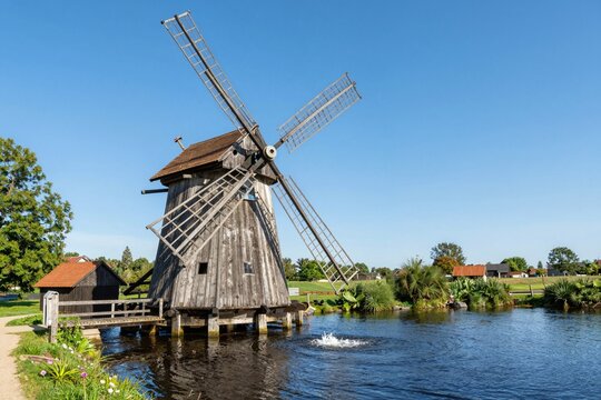 Traditional Windmill in Rural Landscape