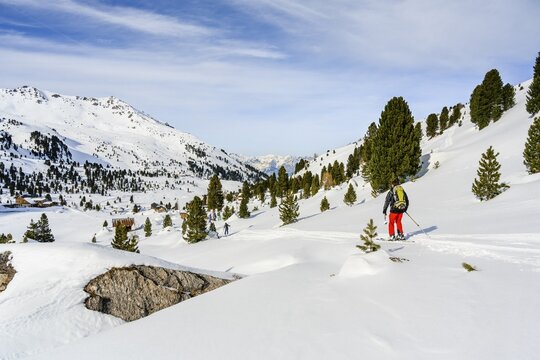 Ski tourers in a snowy mountain landscape, Wattentaler Lizum, Tuxer Alps, Tyrol, Austria