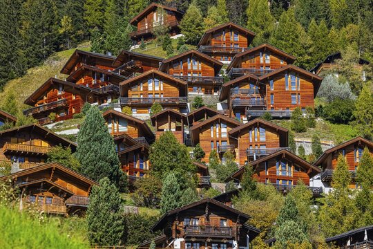 Wooden chalets built into the hillside, Grimentz, Val d'Anniviers, Valais Alps, Canton Valais, Switzerland