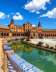Naklejka premium Historic European castle reflected in tranquil pond.