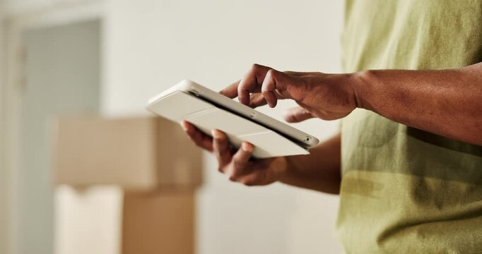 Moving, tablet and hands of man in new home with boxes for interior designing and online shopping. Real estate, mortgage and person with digital tech for ecommerce purchase and apartment renovation