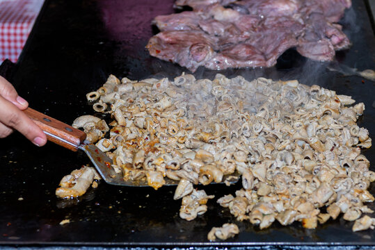 Cooking Beef and Tripe for Traditional Mexican Tacos on a Taqueria Griddle
