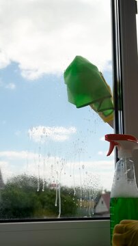 Washing windows spring cleaning. Selective focus.