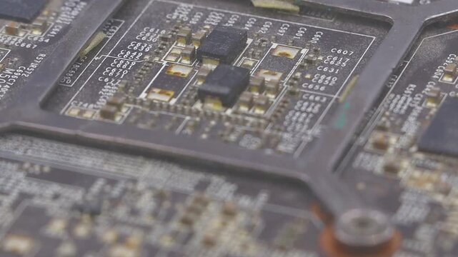 Close-up rotating view of vintage PC graphics card microchip. Perfect for technology, engineering, and retro computing projects.