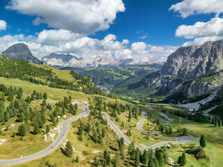 Obraz premium Aerial view of winding road at Passo Gardena in Italian Dolomites