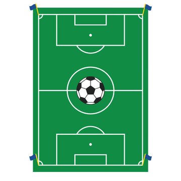 A classic black and white soccer ball is positioned precisely in the center circle of a vibrant green football pitch, with small flags marking the corners.