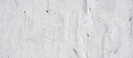 Fototapeta premium A textured surface featuring warm tones of orange and brown, resembling aged plaster or a natural stone wall, ideal for backgrounds or artistic projects.