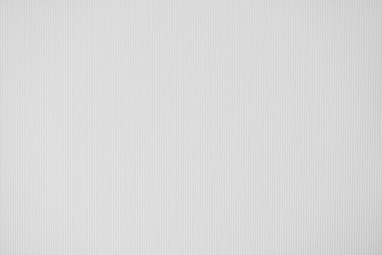 White ribbed paper texture background with vertical grooves