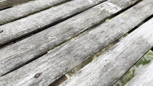 Weathered split bamboo slats texture on rural footbridge
